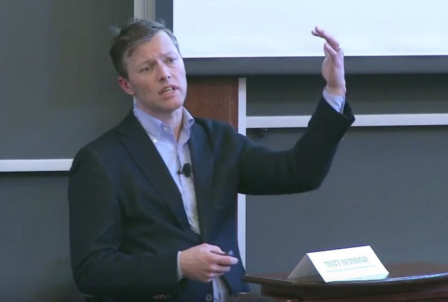 Matt Desmond speaking at the front of the room