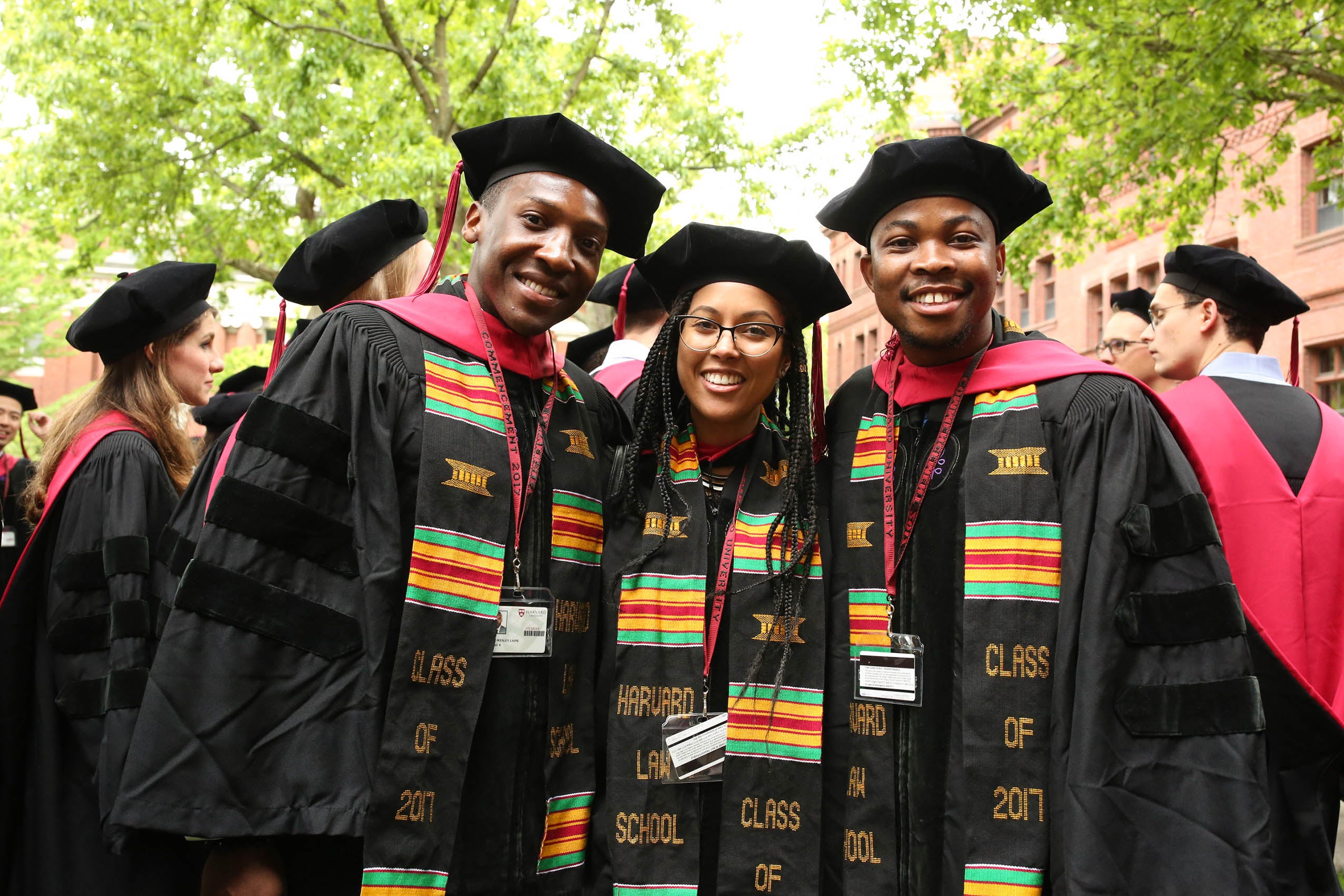 Three students smiling
