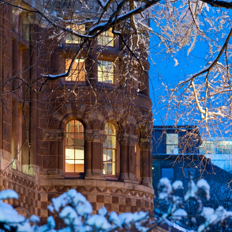 Austin Hall covered in snow at night