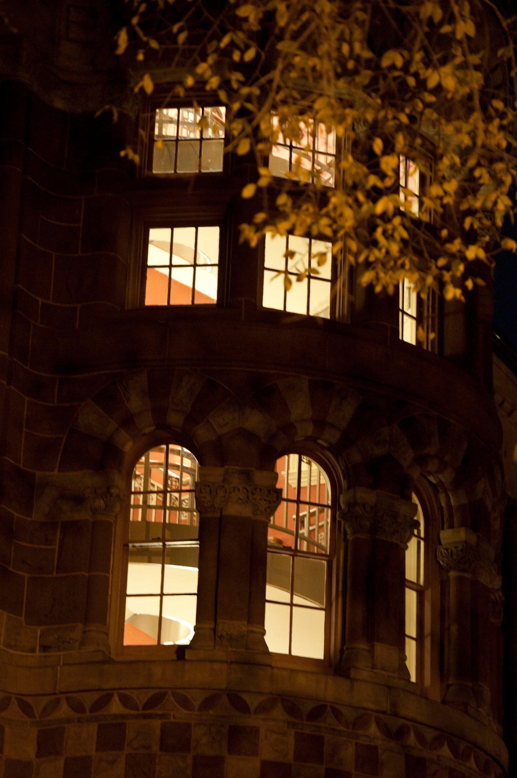Austin Hall windows at night in the fall