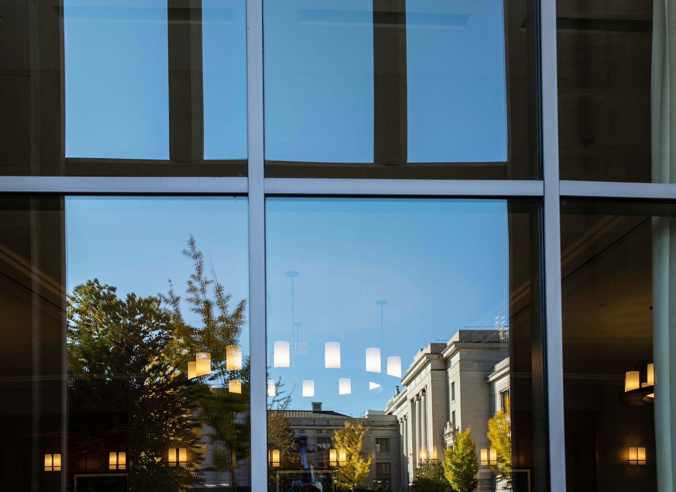 Reflection of Langdell in WCC window in the fall