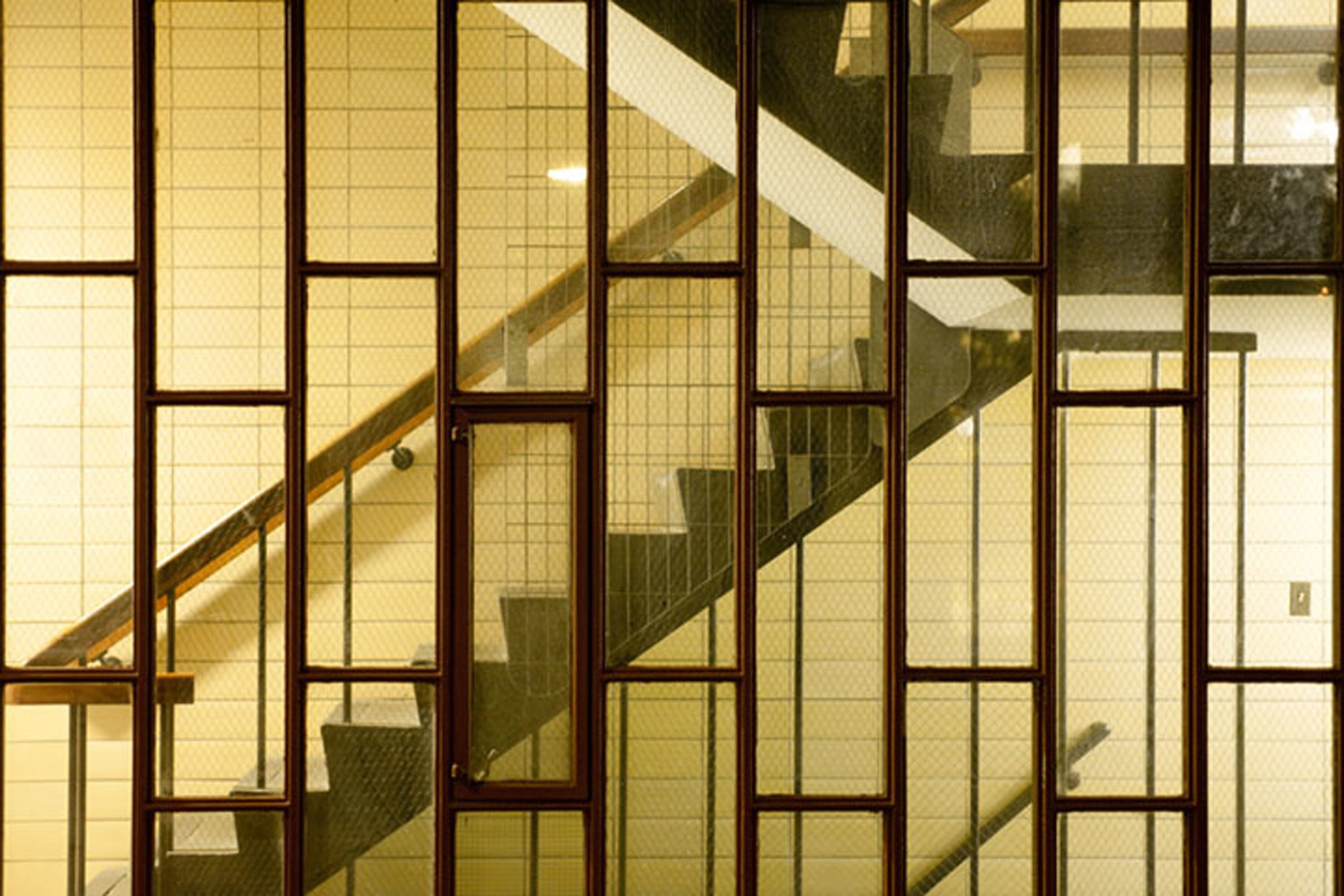 Staircase at night through a window