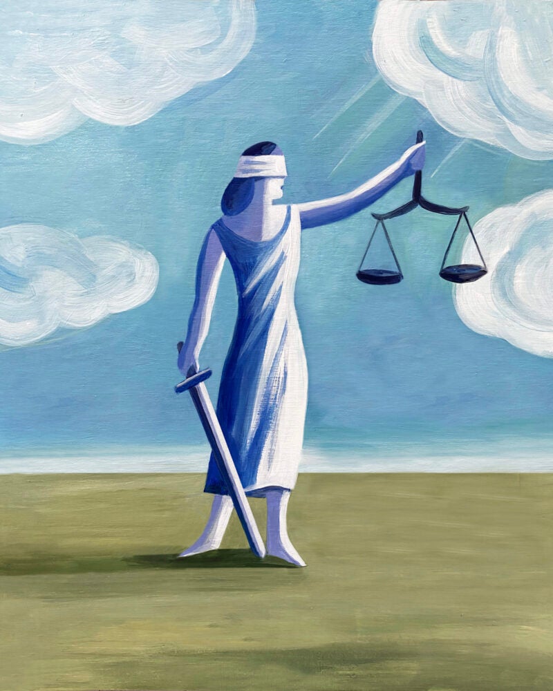 image of blind folded woman holding scales and sword