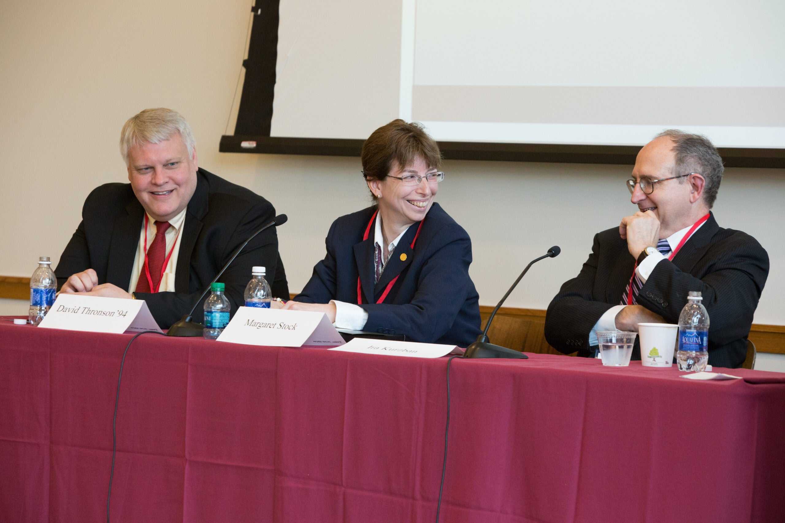 David Thronson, Margaret Stock '92, Ira Kurzban, and Pratt speaking at a table in front of the room
