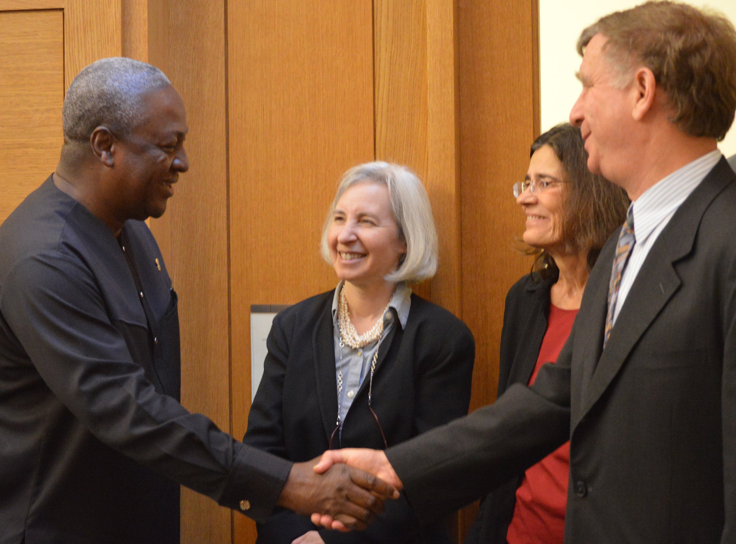 Mahama shaking hands with William Alford