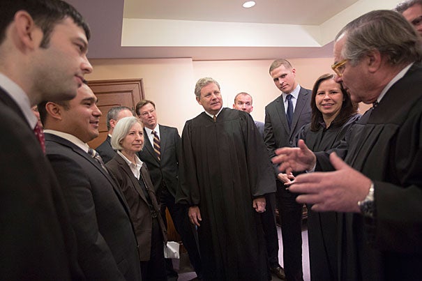 Martha Minow and students in black robes