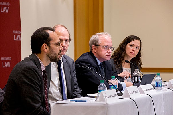 Andrew Crespo, Cass Sunstein, and Adrian Vermeule, Ralph S. Tyler, Jr. sitting at table with microphones