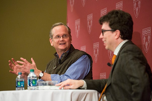 Lawrence Lessig and Jonathan Zittrain sitting together at at table talking