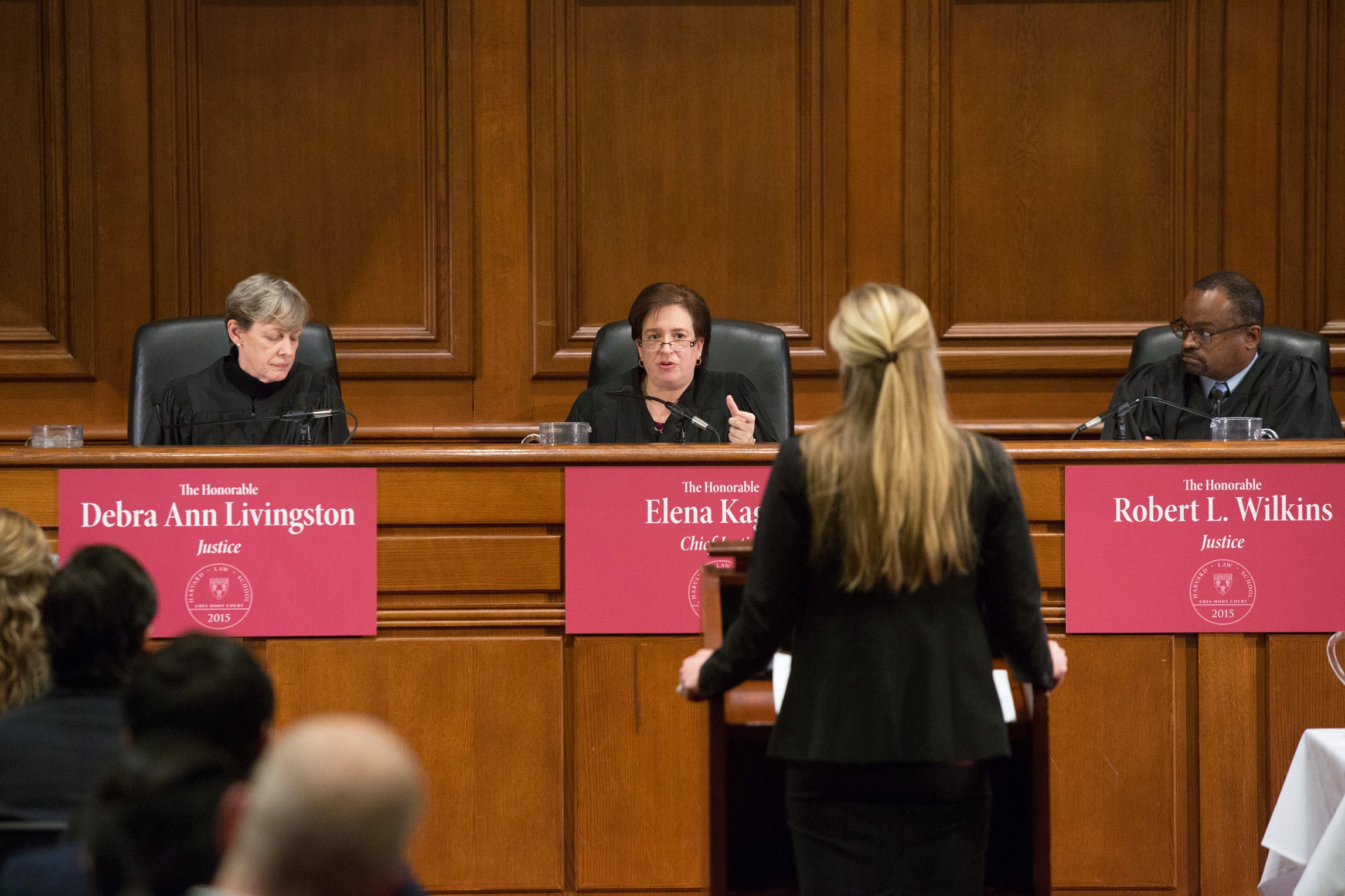 Judges at the front of the courtroom