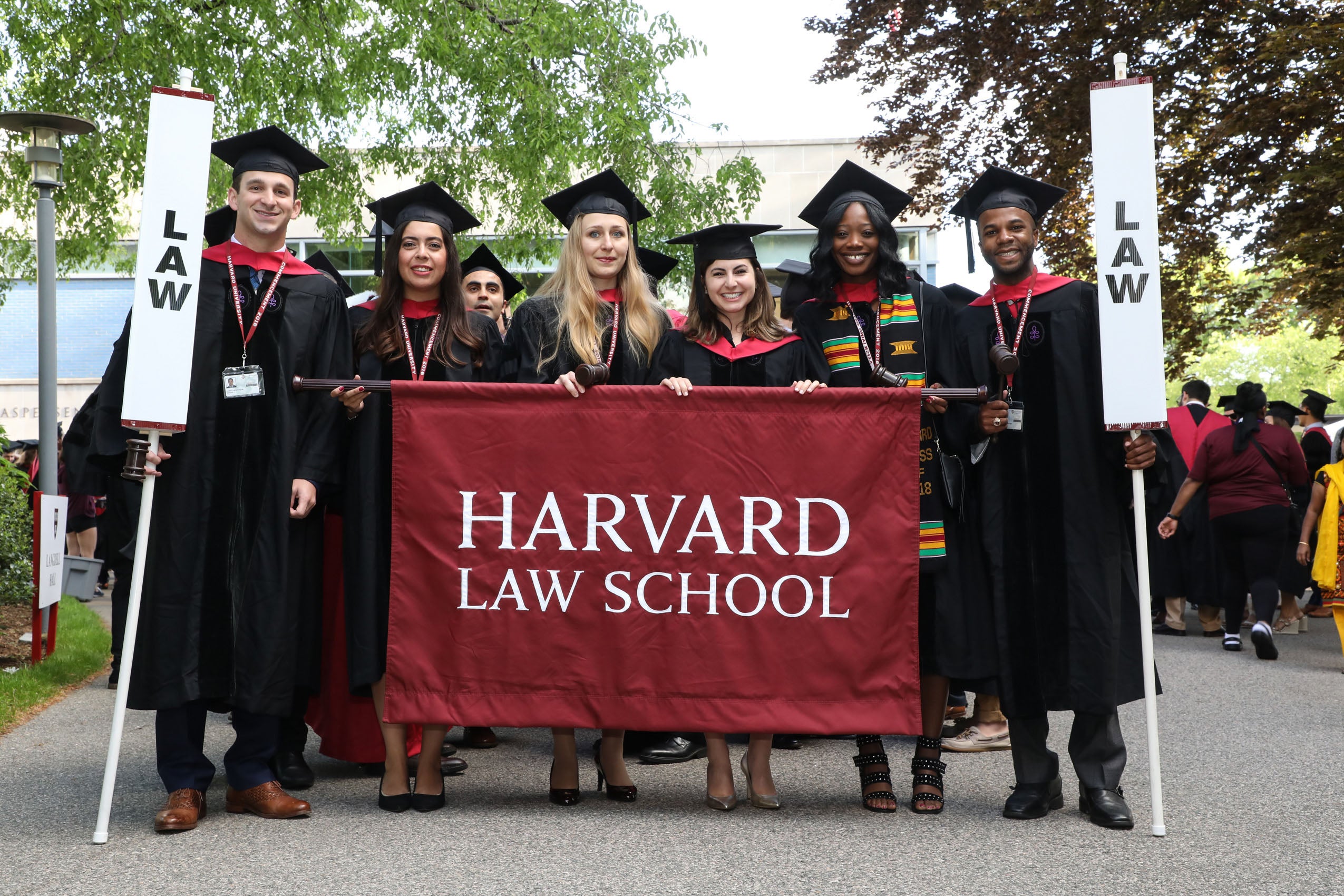 Class Marshals hold HLS banner at Commencement