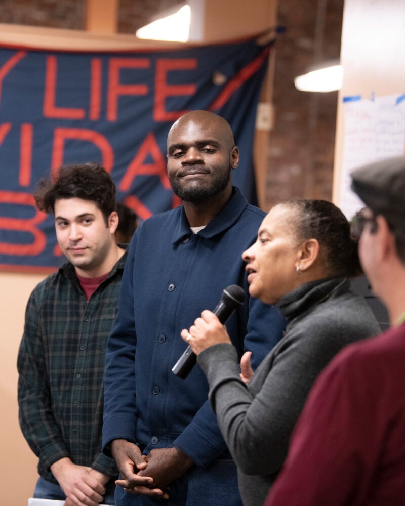 Image of four people presenting at the City Life Vida Urbana