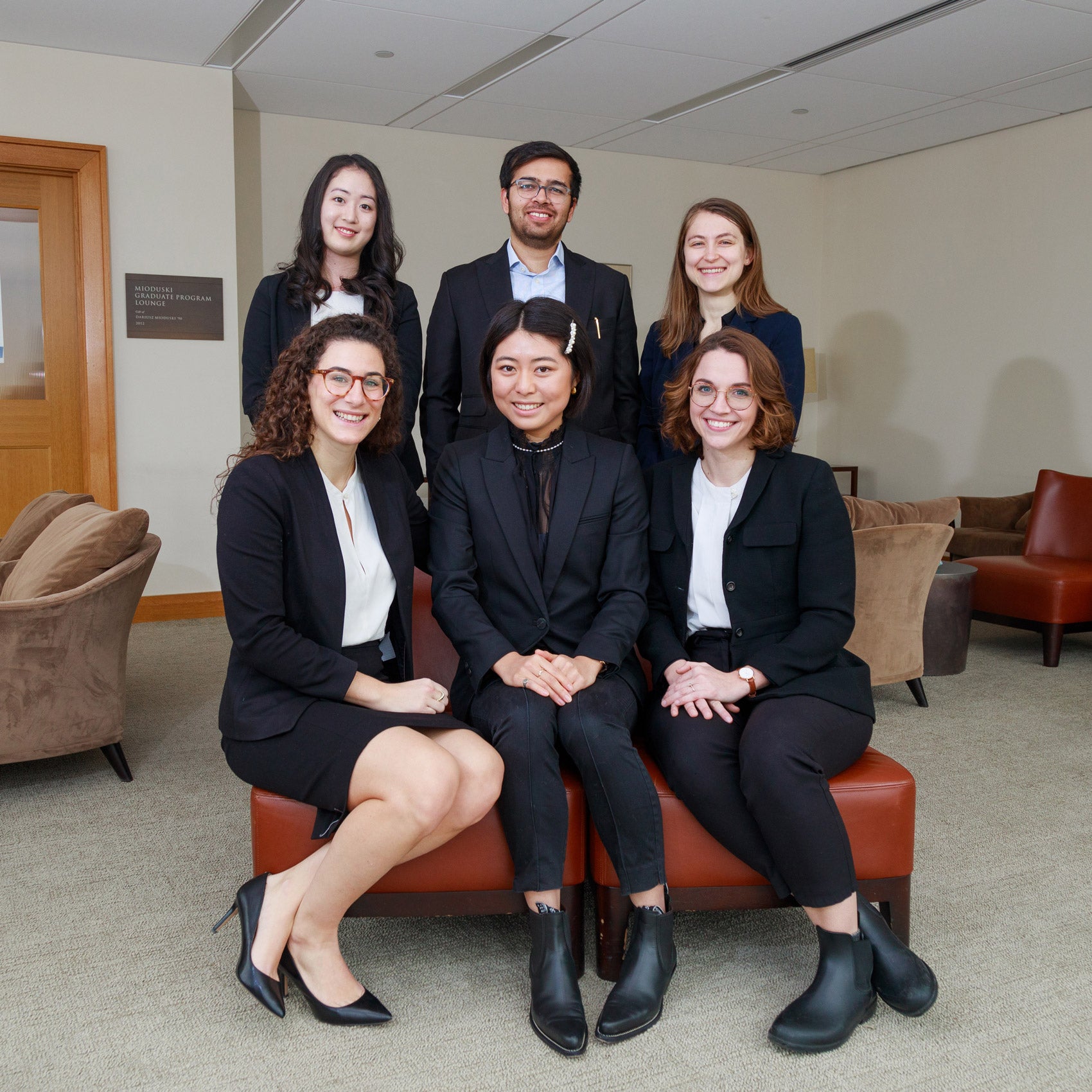 Group photo of five women and one man