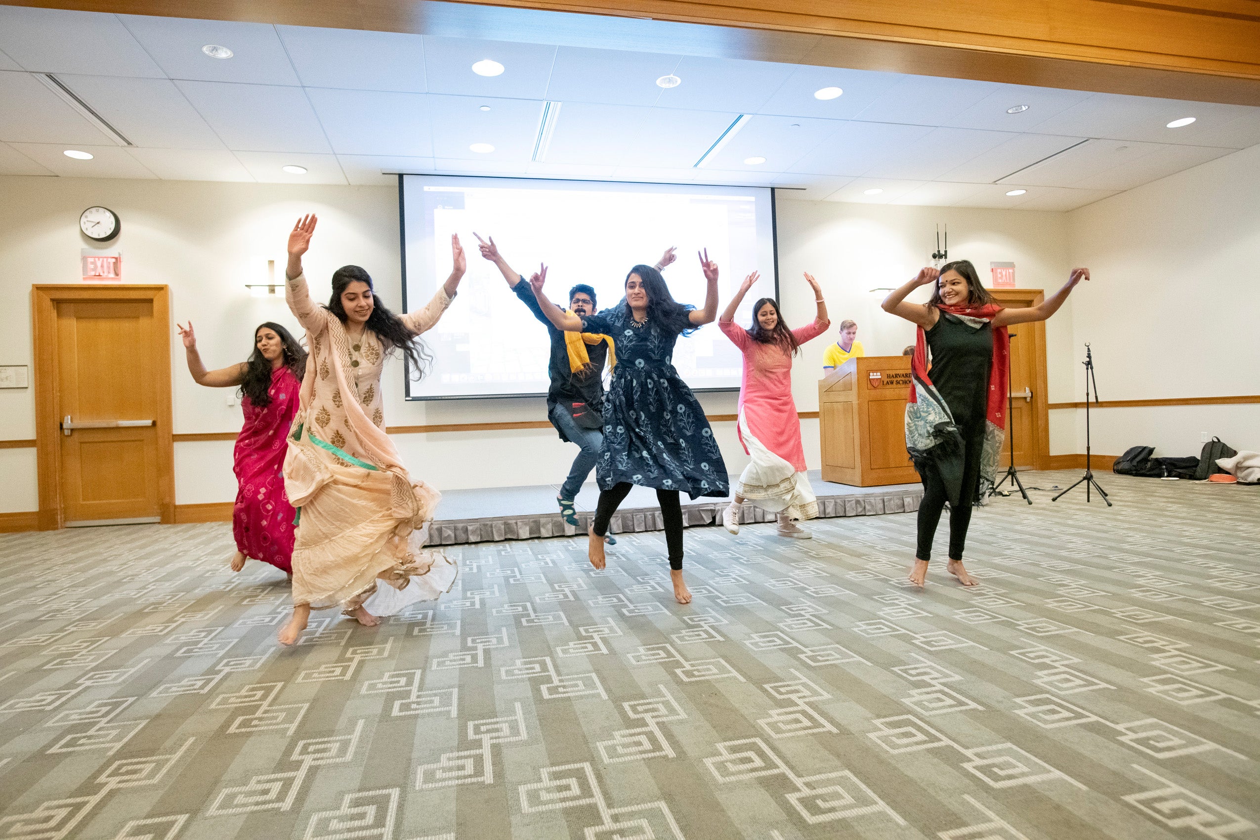 Six students perform a lively dance at an international night at HLS