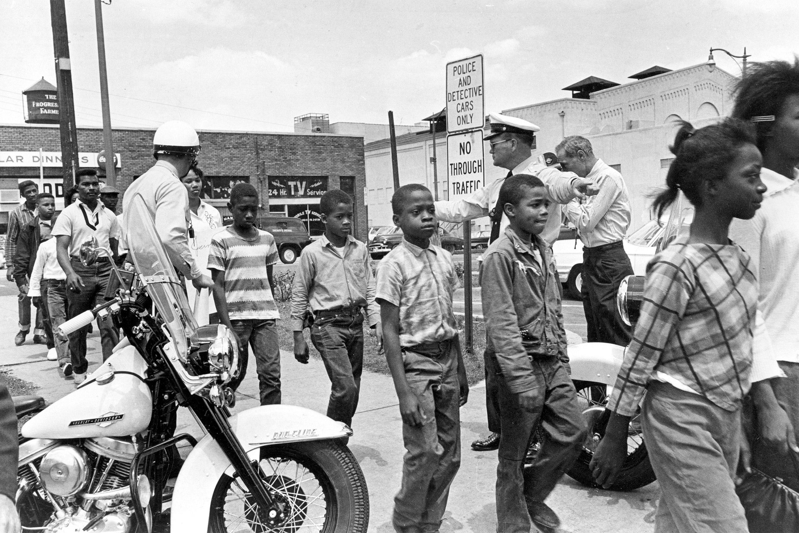 Black children being led to jail by policemen in Birmingham, Alabama