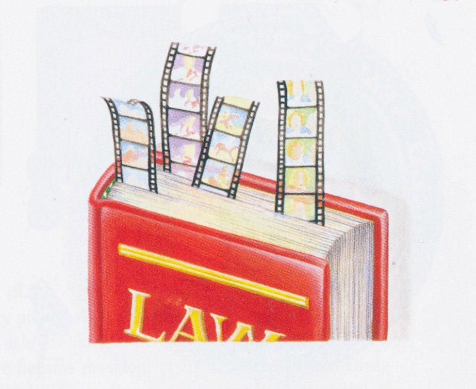 Law book with film strips coming out