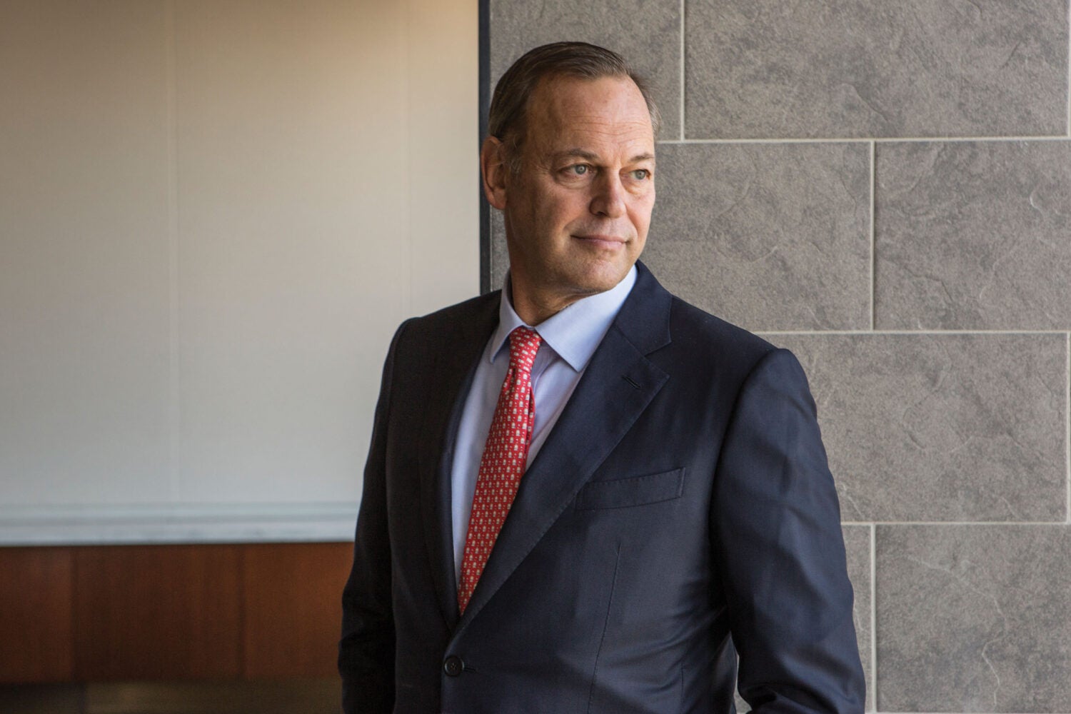Steve Kinsky posing in front of a wall