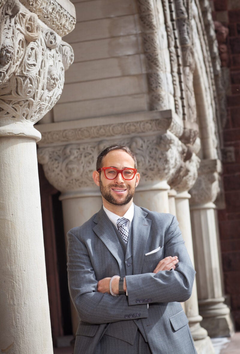 Glenn Cohen wearing bright red glasses
