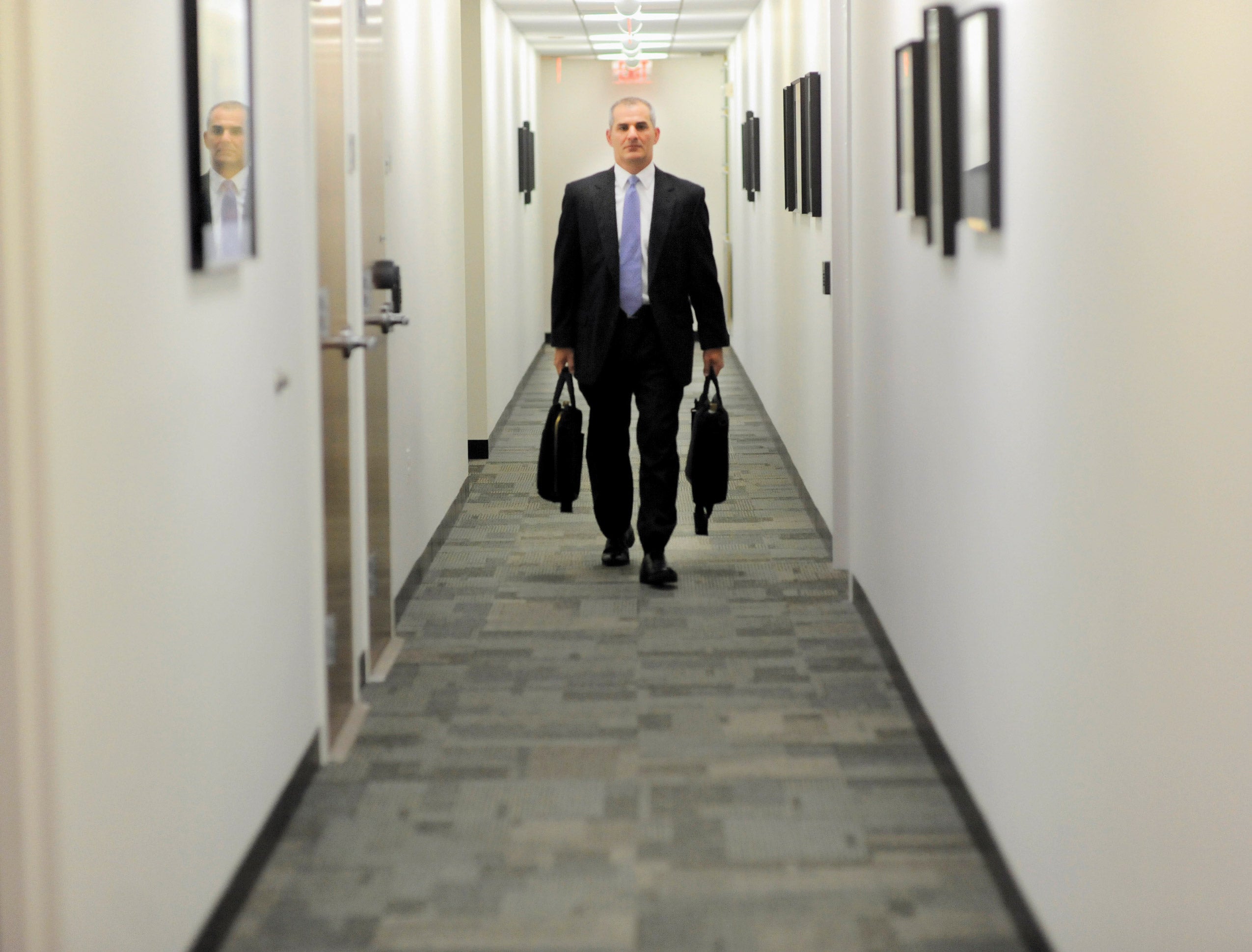 Michael Leiter walking down a hall