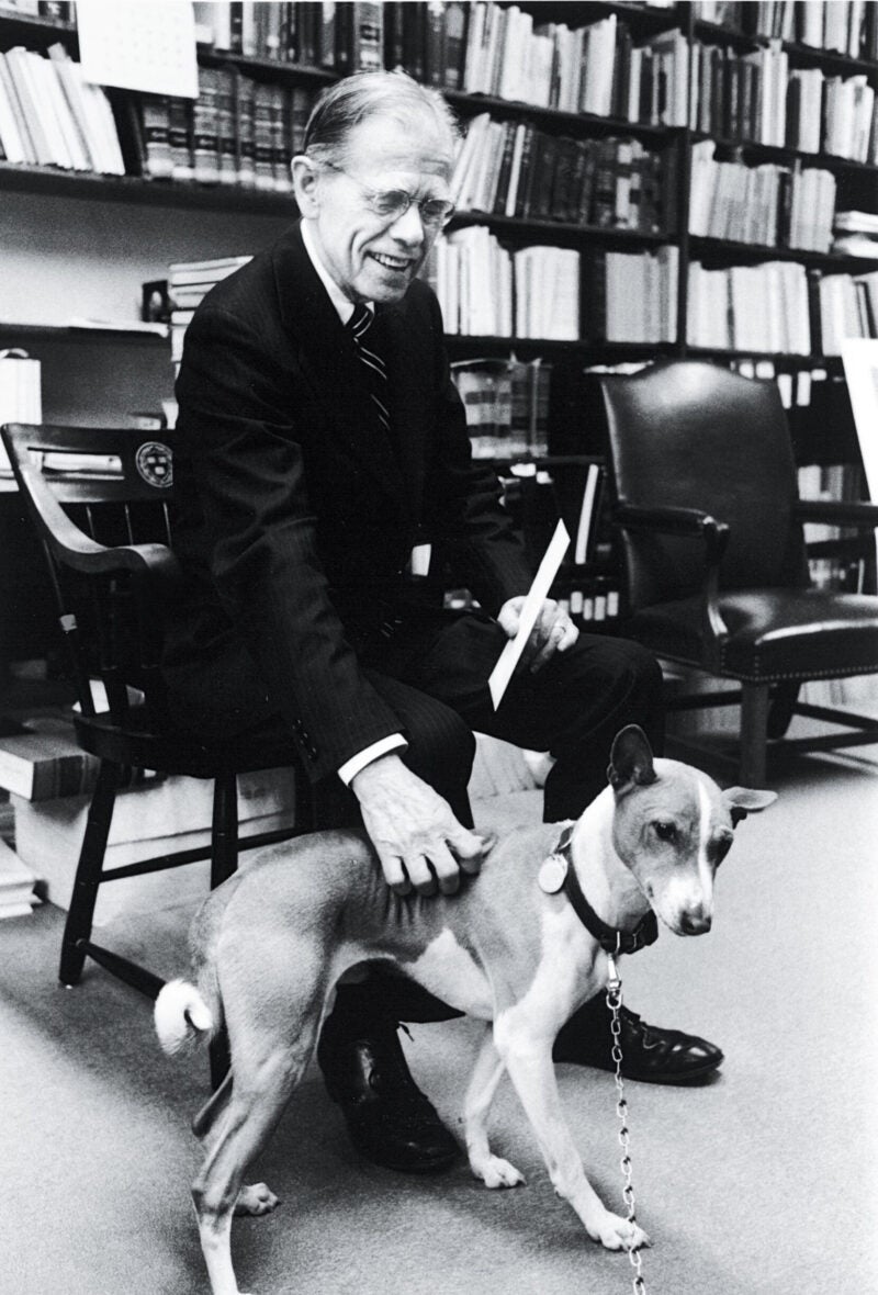 Clark Byse in 1983 in his office with his dog