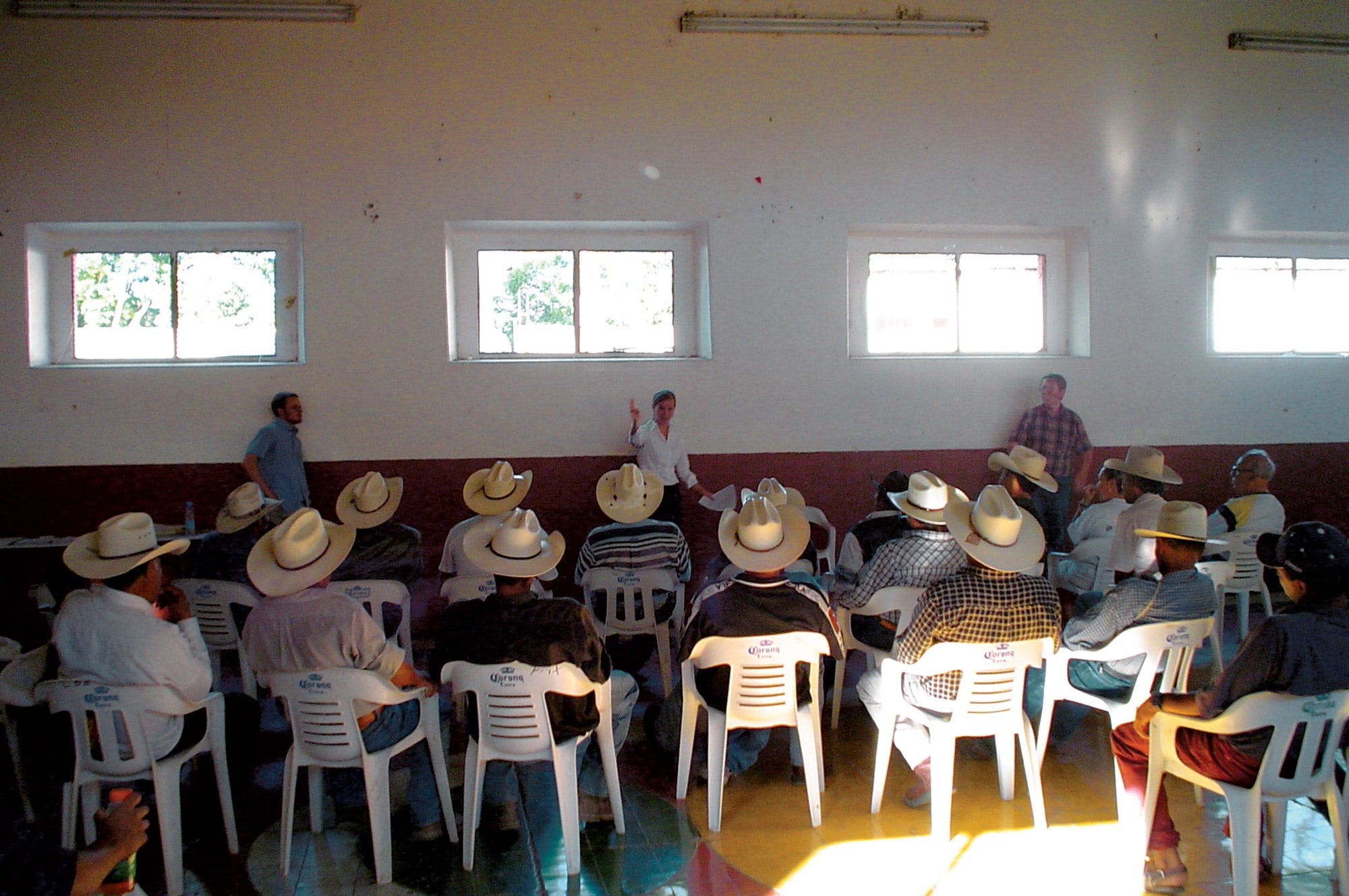 Meeting of men in cowboy hats