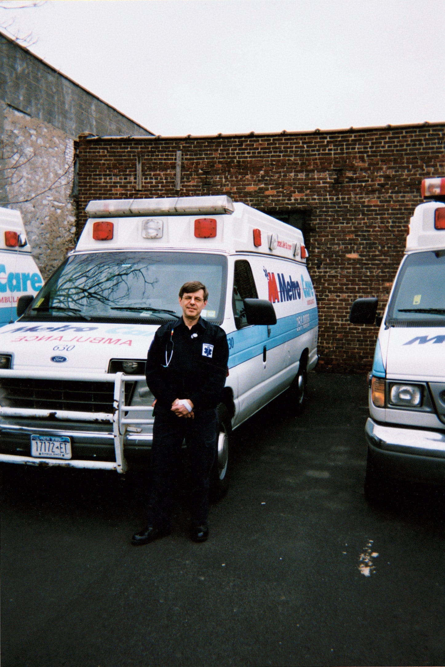 Richard Wells standing by ambulance