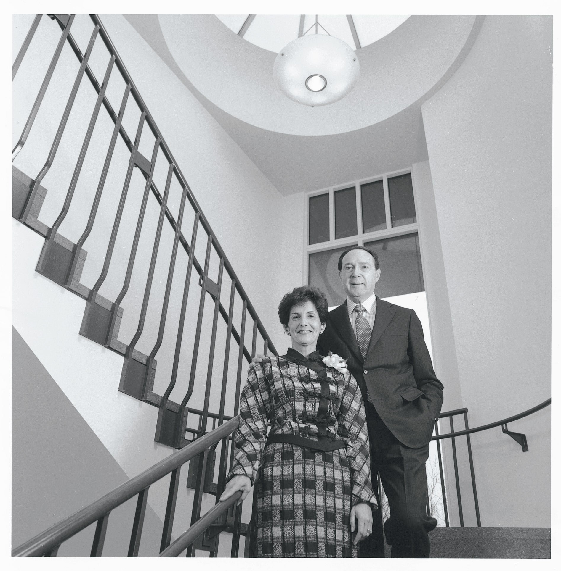 Gustave and Rita Hauser on stairs