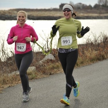 Kristin Fleschner '14 [right] running with friend/guide Jess Kochman