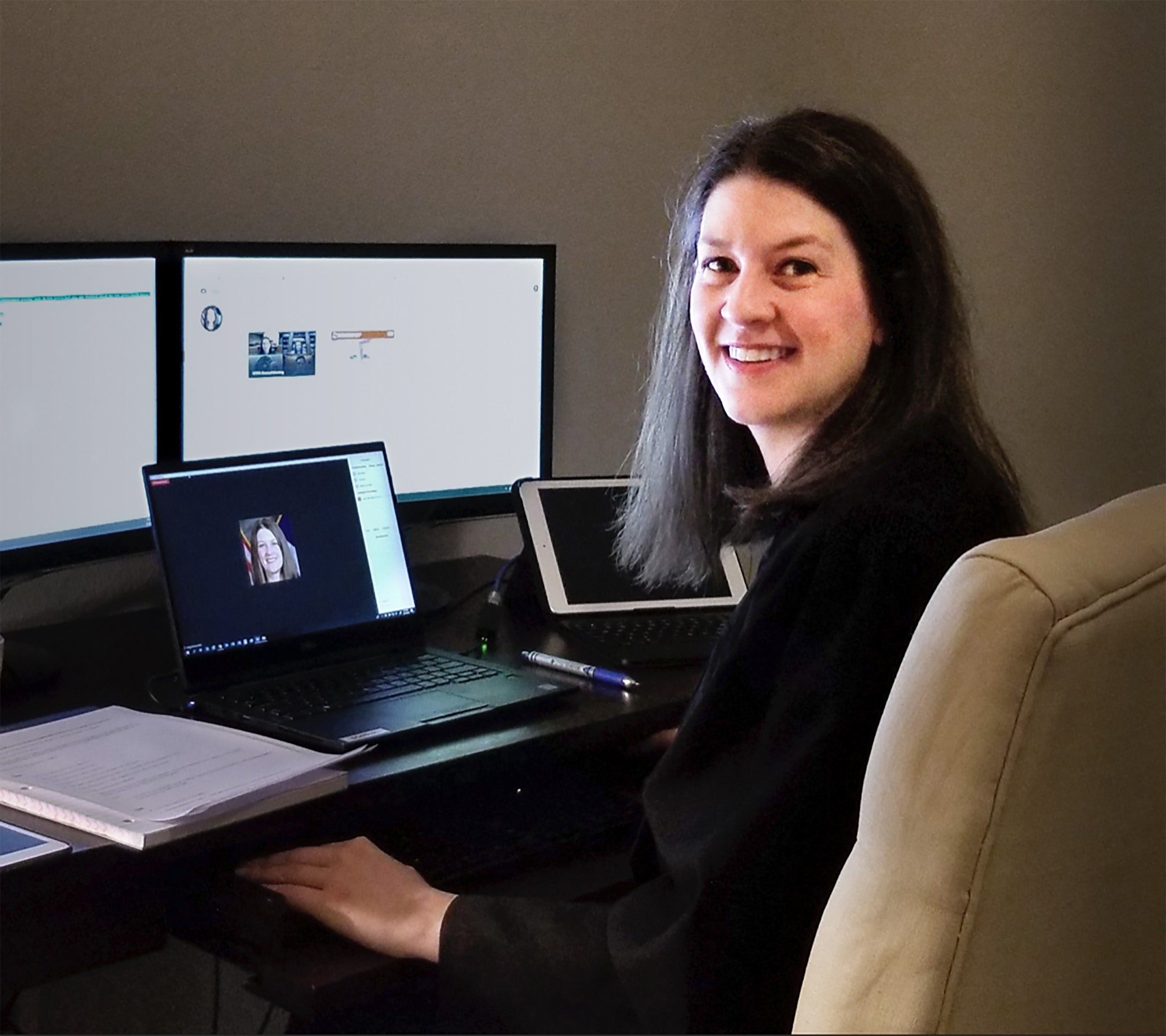 Emily Miskel sitting at her computer preparing for a virtual trial