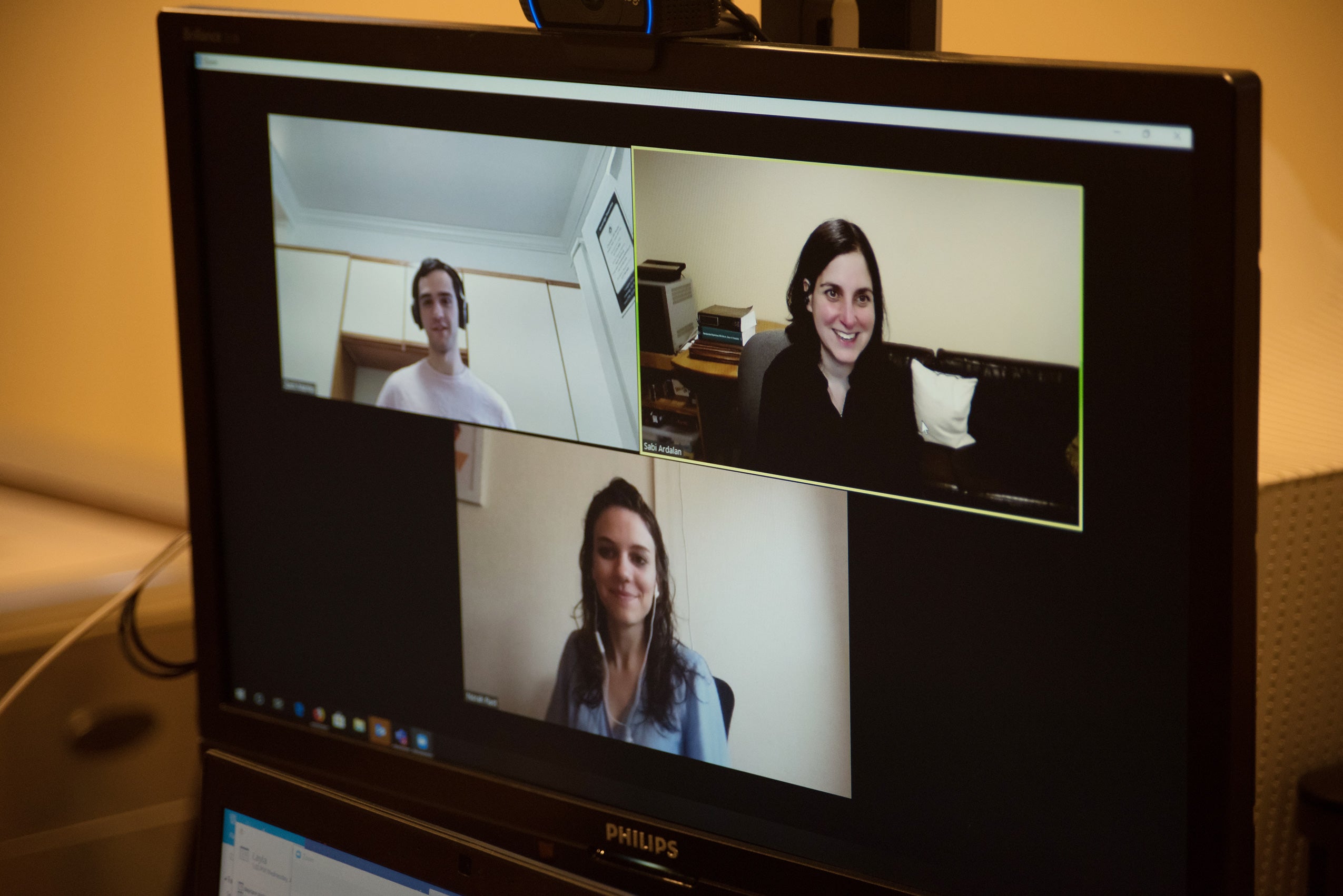 Screen shot of an online meeting with professor and a male and female student