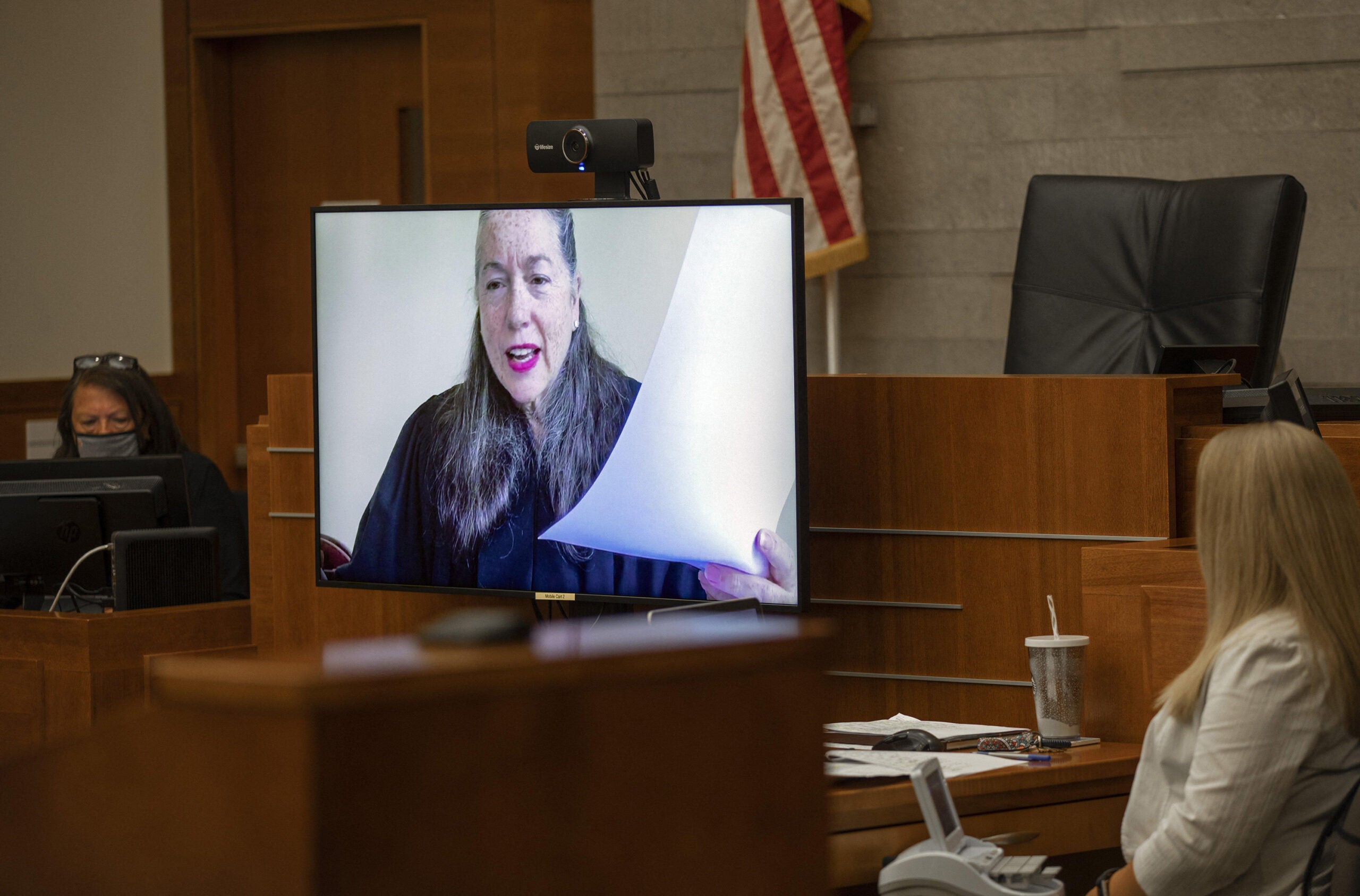 Judge Julie M. Lynch presides over a courtroom remotely
