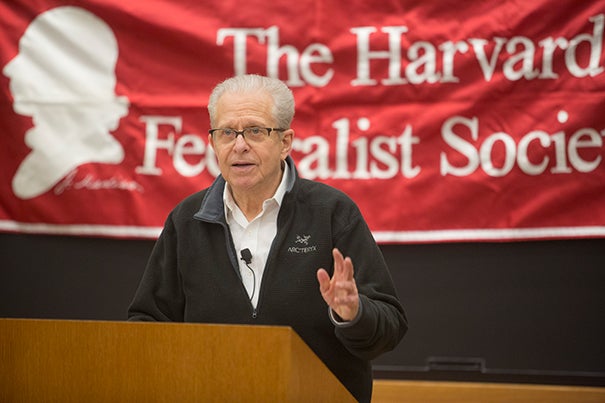Professor Laurence Tribe speaking at a podium