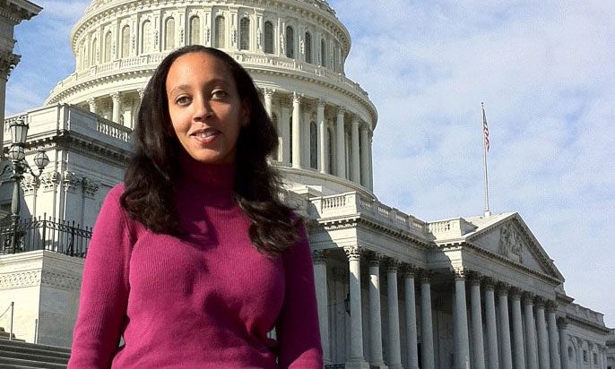 Haben Girma standing in front of the White House