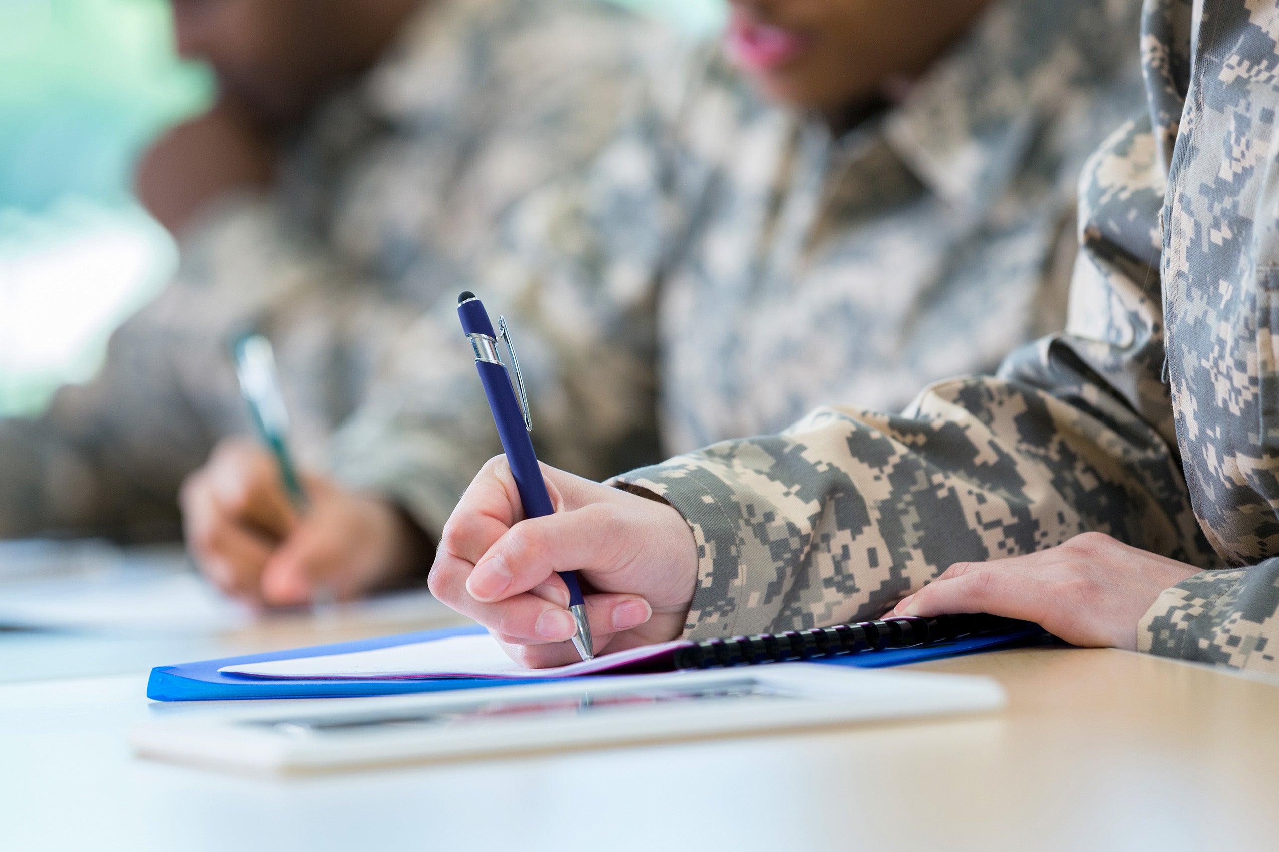 Military veterans taking notes