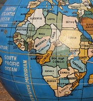 Close up of an outdated globe showing old African borders