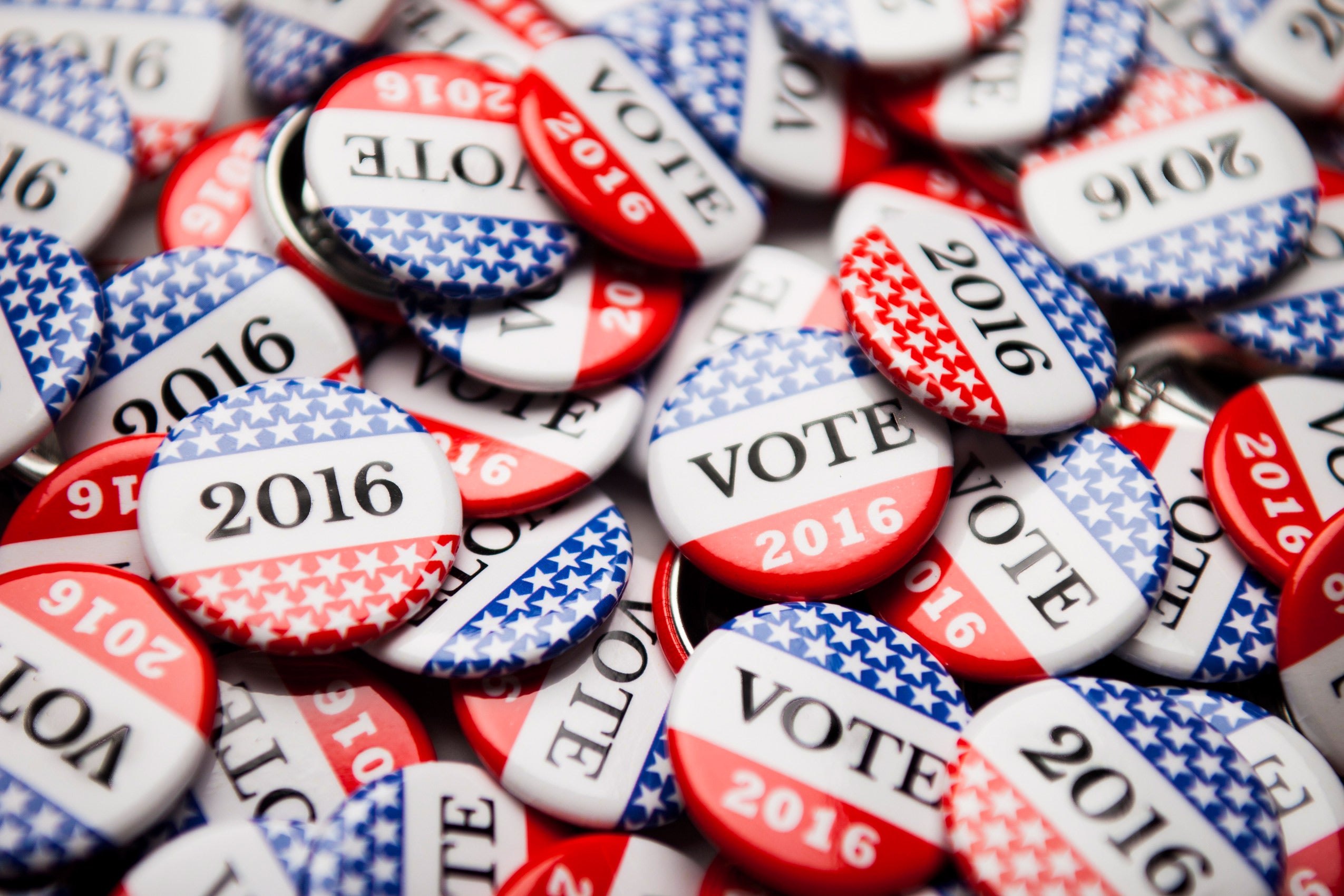 Photo of a pile of Vote 2016 lapel buttons