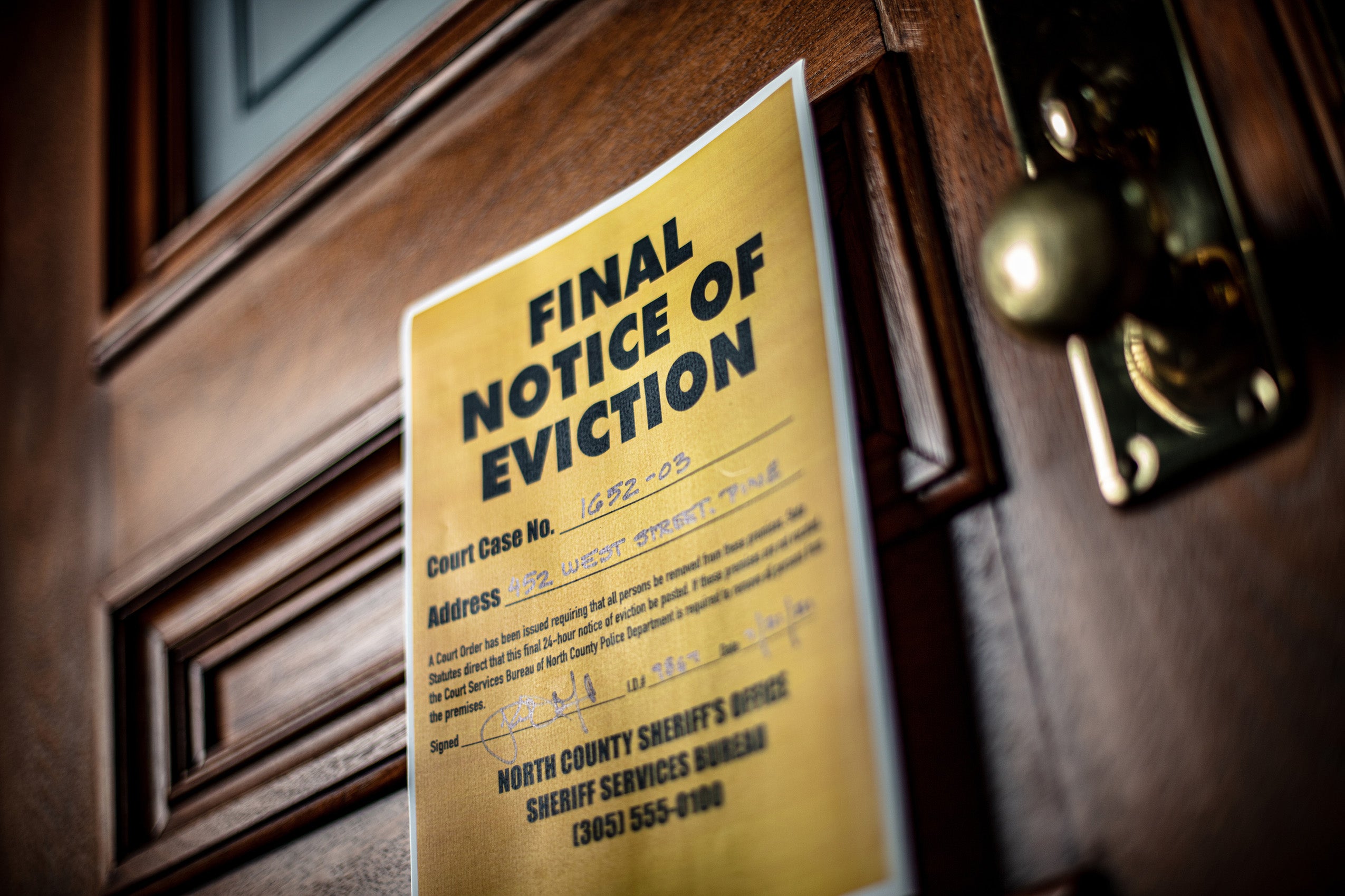 Notice of eviction on door of house