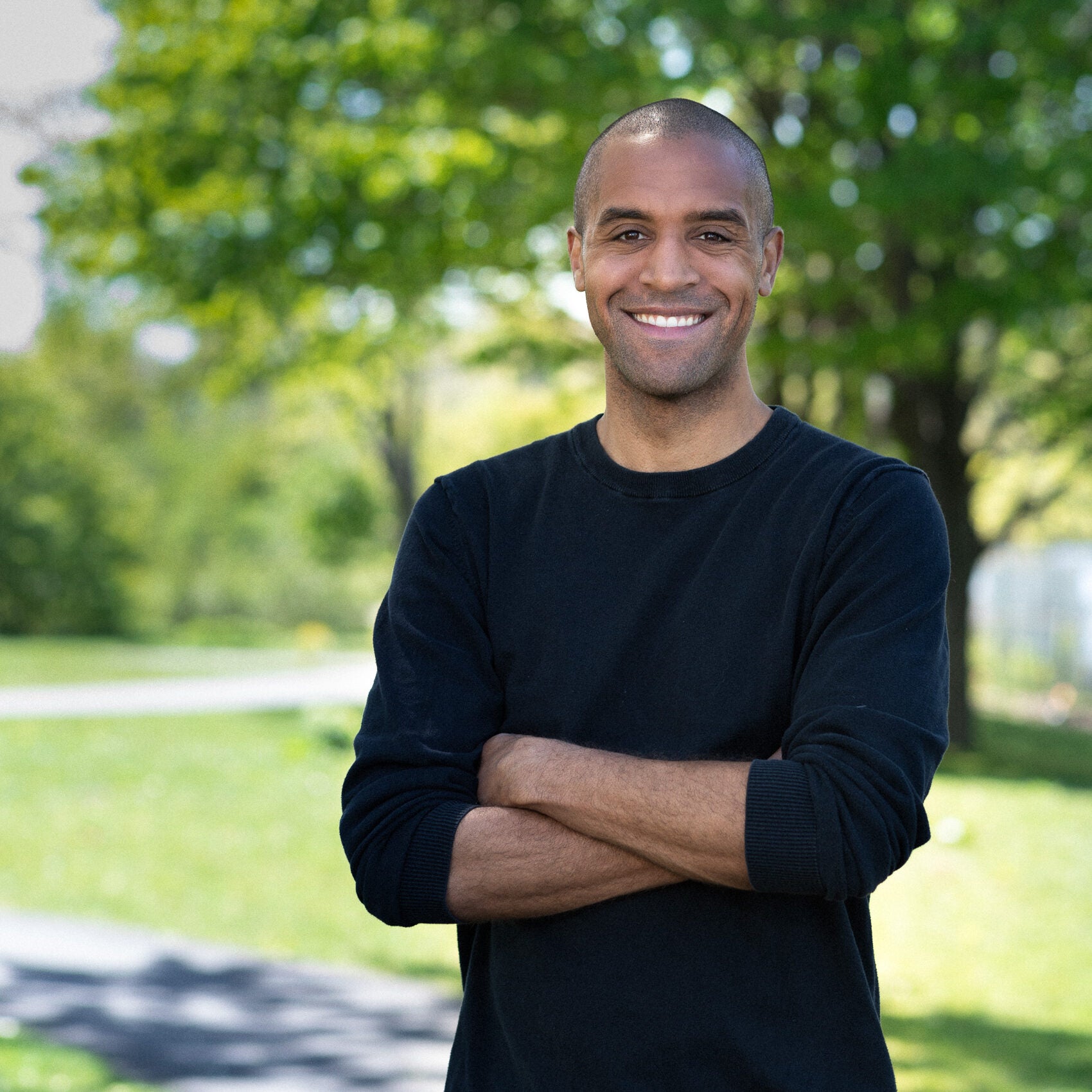 Niko Bowie standing with arms crossed