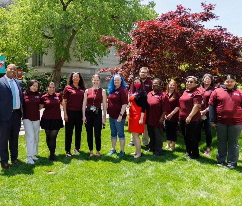 The Dean of Students Office staff posing outdoors on Commencement Day.