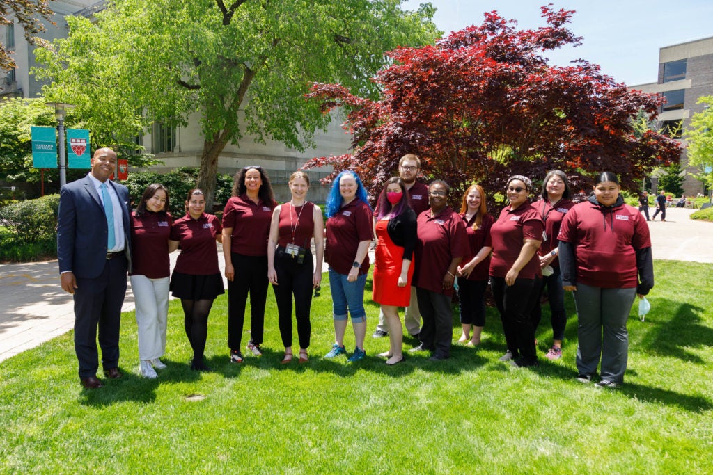 The Dean of Students Office staff posing outdoors on Commencement Day.
