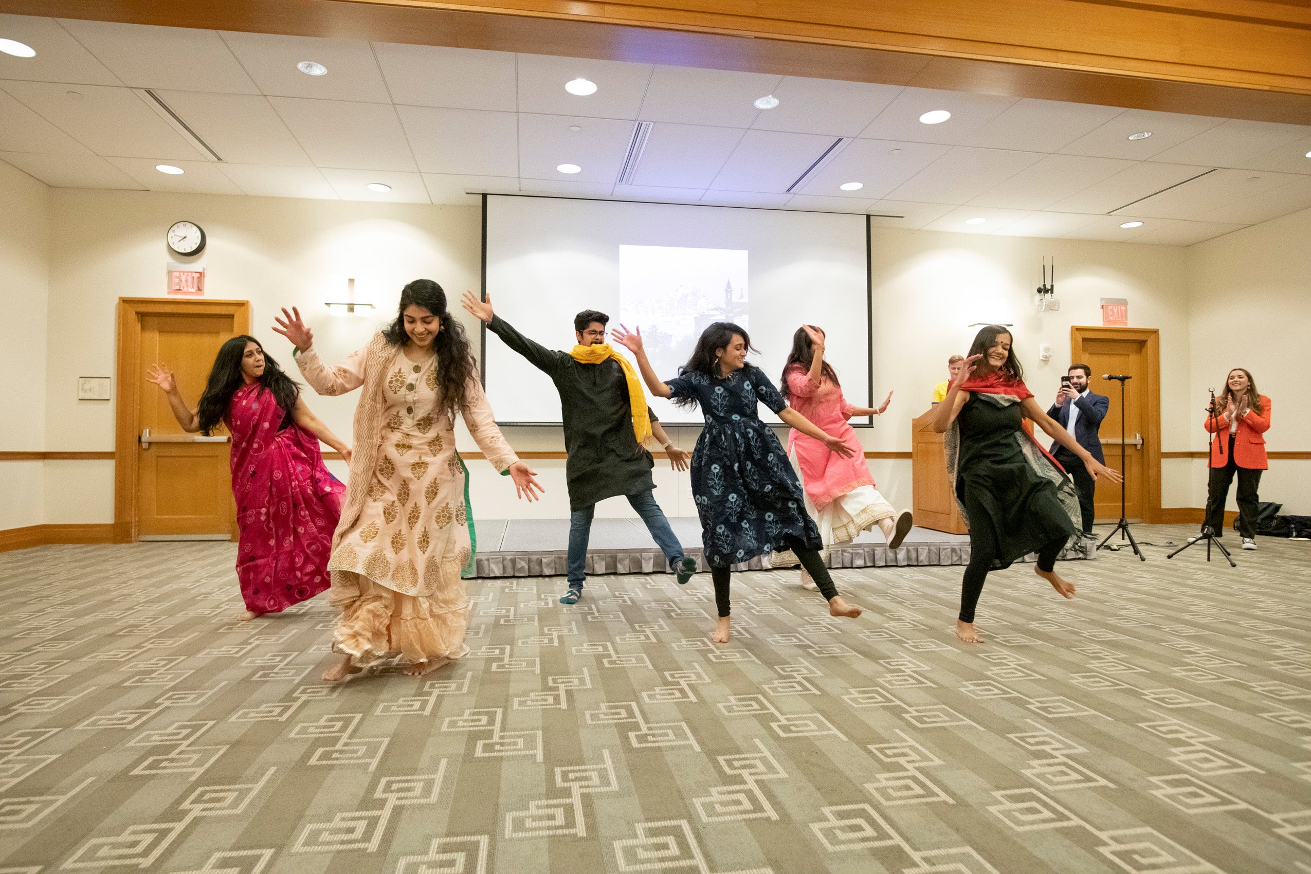 Six students perform a lively dance at an international night at HLS