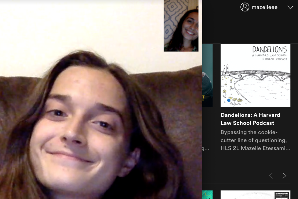 Screenshot from a laptop of two students talking.