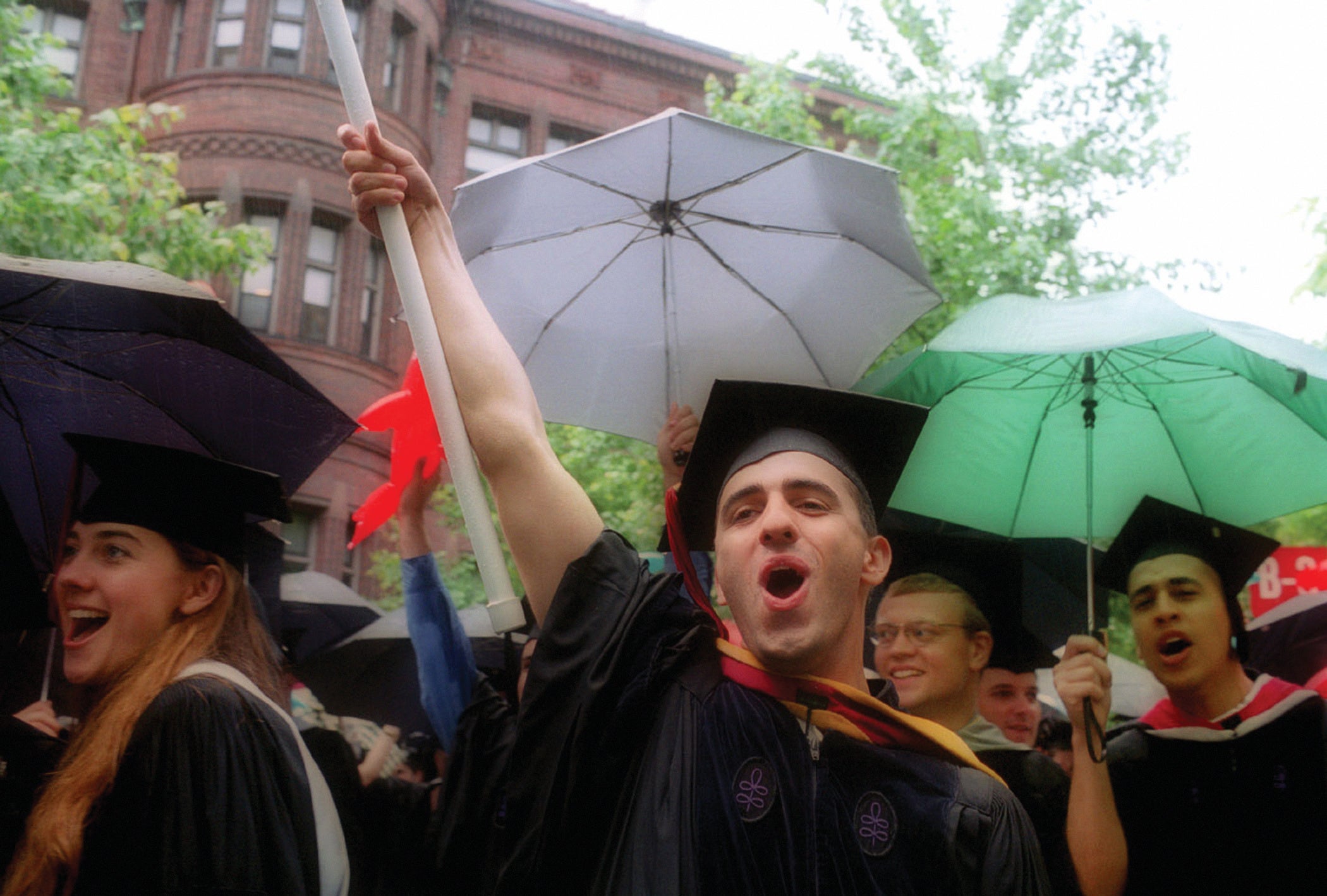 Students with umbrellas at 2002 commencement