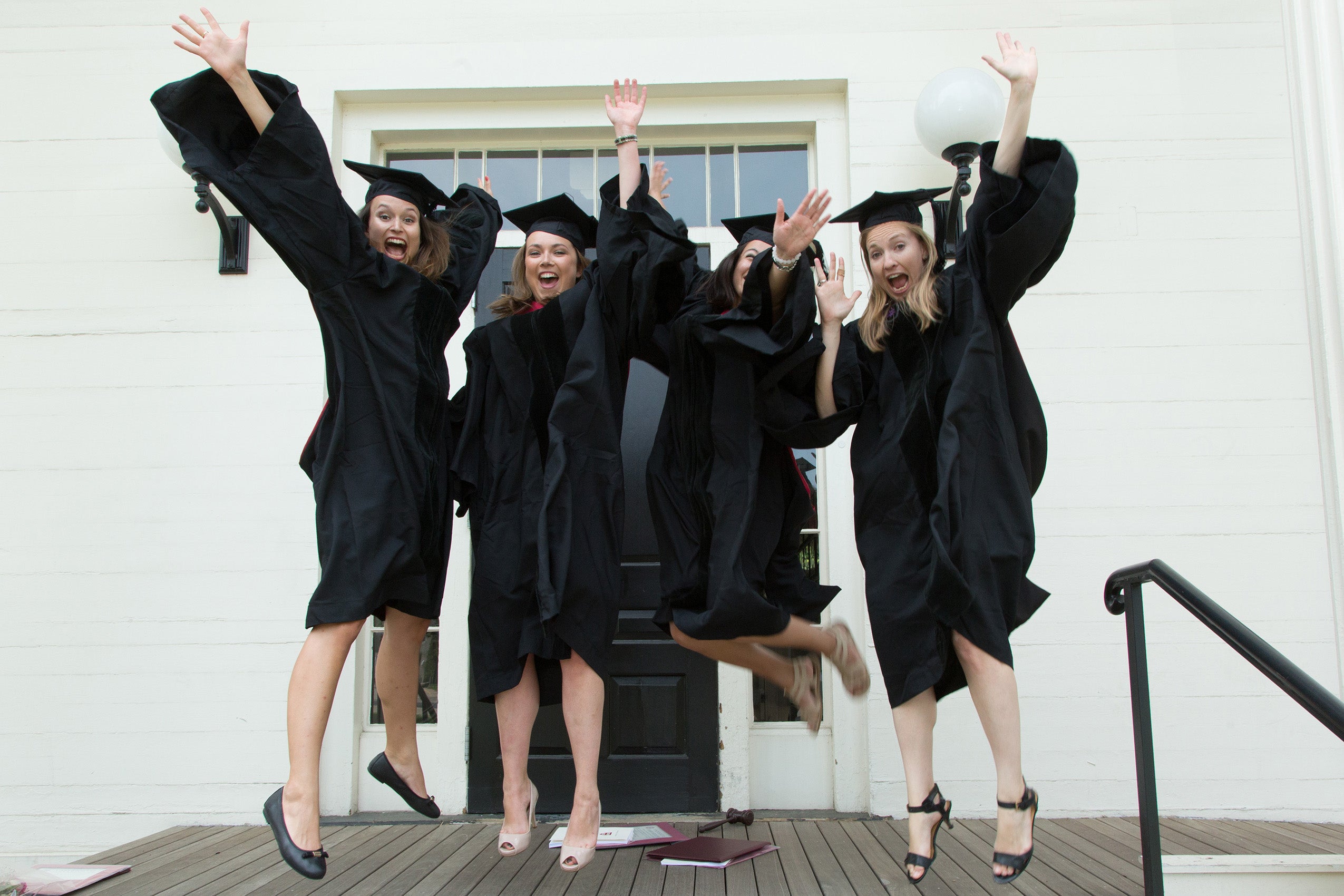 Class of 2016 students jumping on Gannett steps.
