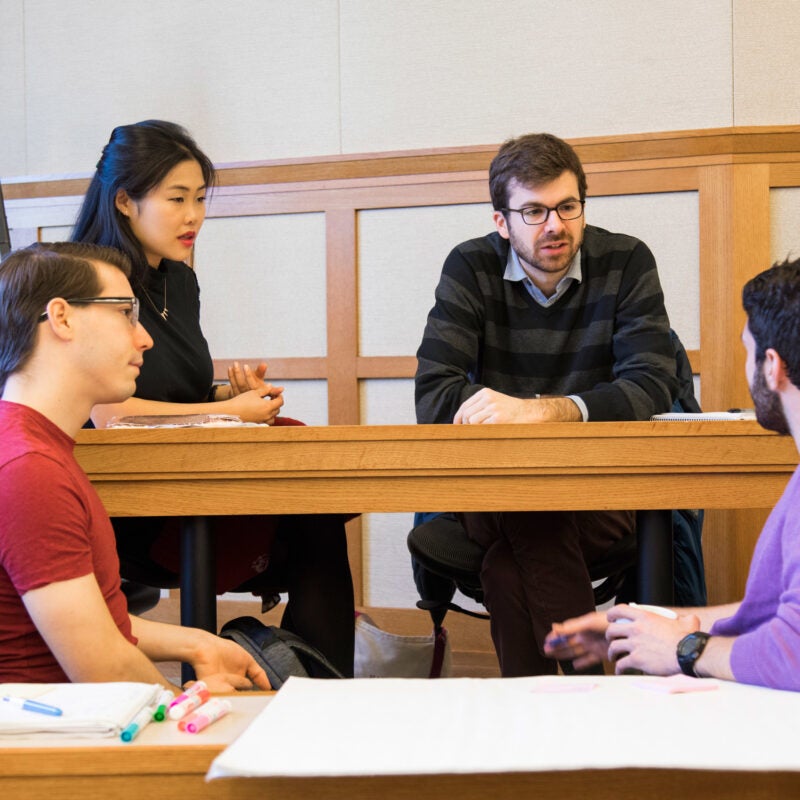 A group of students having a discussion in a WCC classroom