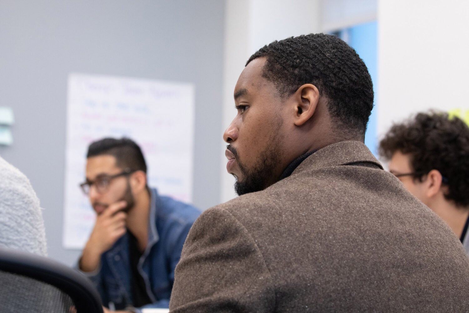 Closeup of students sitting around a table.