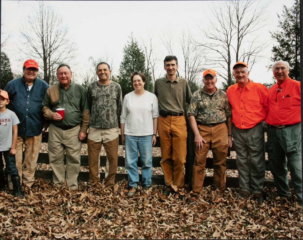 U.S. Supreme Court Justices Antonin Scalia, far left, and Elena Kagan ’86, center, on a group hunting trip.