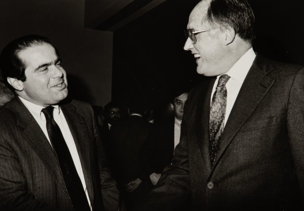 Antonin Scalia shakes hands with U.S. Supreme Court Chief Justice William Rehnquist
