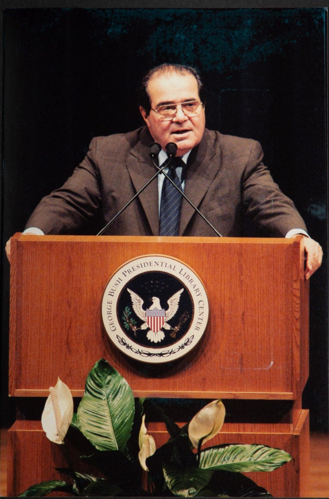 Antonin Scalia speaking at a podium