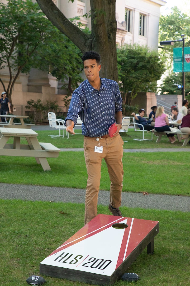 someone playing corn hole