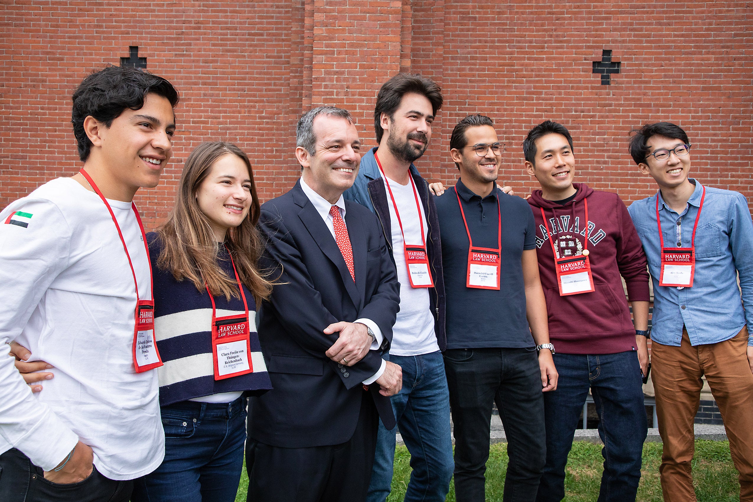 Dean Manning poses with students outside Sanders Theatre